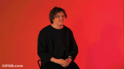 Man In Black Shirt Sitting GIF