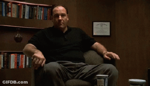 Man In Black Shirt Sitting With Bingo GIF
