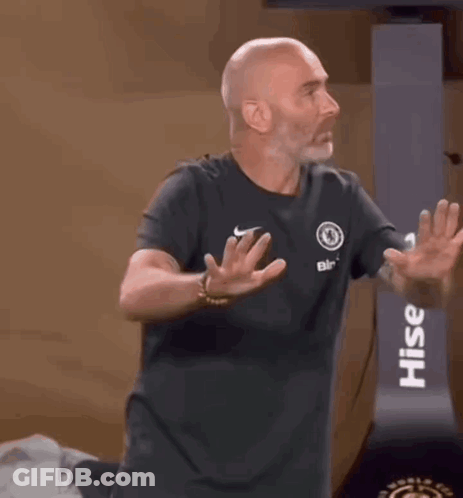 Man In Black Shirt Smiling Arms Outstretched In Front Of Crowd GIF
