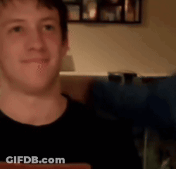 Man In Black Shirt Smiling At Camera GIF