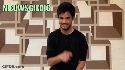 Man In Black Shirt Smiling In Front Of Nieuwsgierig Wall GIF