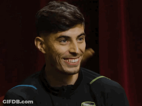 Man In Black Shirt Smiling With Arsenal GIF