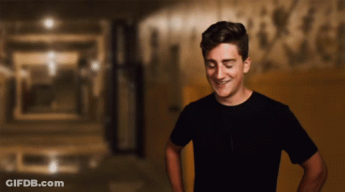 Man In Black Shirt Smiling With Eyes Closed GIF
