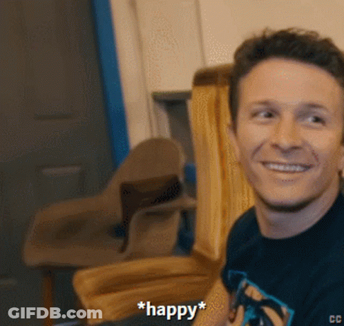 Man In Black Shirt Smiling With Word Happy GIF