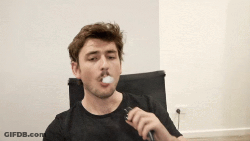 Man In Black Shirt Smoking Cigarette GIF