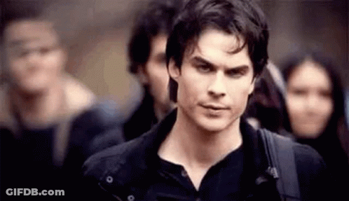 Man In Black Shirt Standing Before Crowd GIF