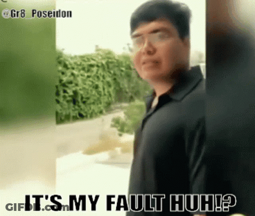 Man In Black Shirt Standing Before Fault Sign GIF