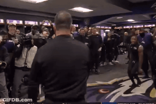 Man In Black Shirt Standing Before Group GIF