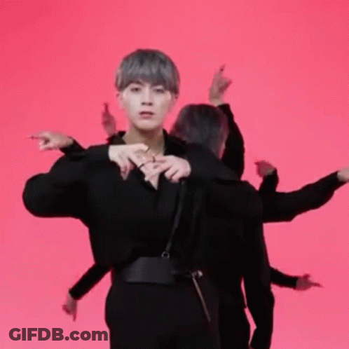 Man In Black Shirt Standing Before Group GIF