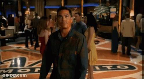 Man In Black Shirt Standing Before Monte Sign GIF