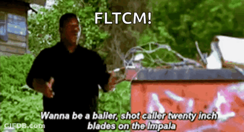 Man In Black Shirt Standing By Red Trash Can Says Fltcm GIF