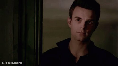 Man In Black Shirt Standing In Front Of Door GIF