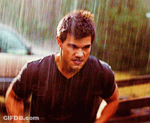 Man In Black Shirt Standing In Rain GIF