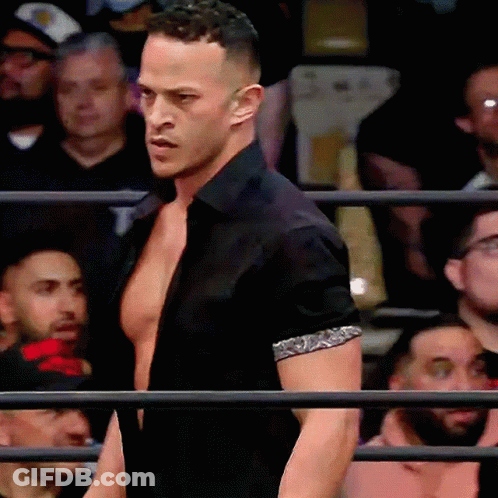 Man In Black Shirt Standing In Ring GIF