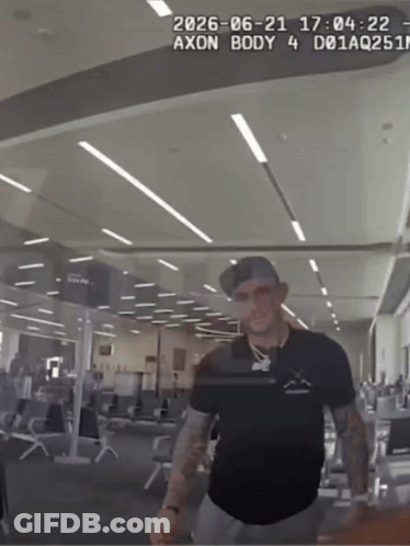 Man In Black Shirt Standing With Axon Body 4 GIF