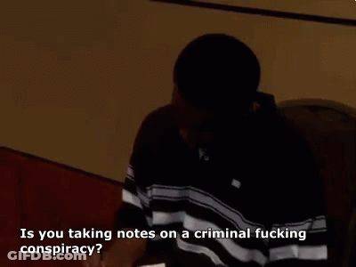 Man In Black Shirt Talking About Criminal Conspiracy Notes GIF