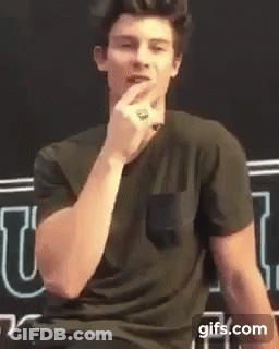 Man In Black Shirt Talking Into Microphone GIF