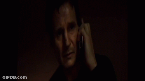 Man In Black Shirt Talking On Cell Phone GIF