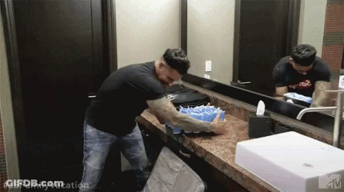Man In Black Shirt Washing Hands GIF