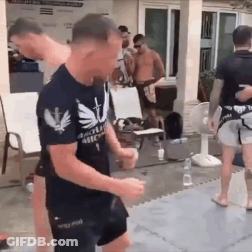 Man In Black Shirt With Cross Dancing GIF