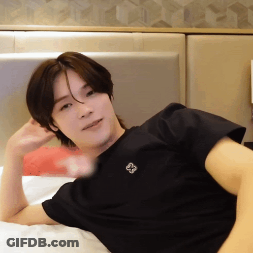 Man In Black Shirt With Cross GIF