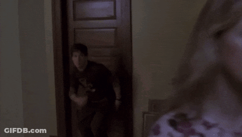 Man In Black Shirt With D In Dark Room GIF