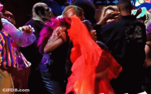 Man In Black Shirt With Dragon Dancing With Woman In Red Dress GIF