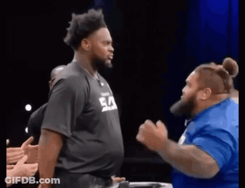 Man In Black Shirt With Ea Next To Man In Blue GIF