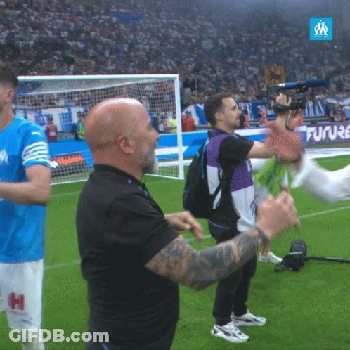 Man In Black Shirt With H On Shorts On Soccer Field GIF