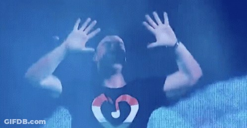 Man In Black Shirt With Heart And Letter G GIF