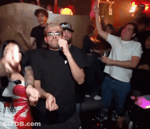 Man In Black Shirt With Letter F Dancing In Crowd GIF