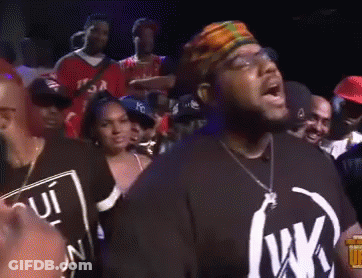 Man In Black Shirt With Letter W In Front Of Crowd GIF
