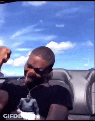Man In Black Shirt With Man Statue GIF