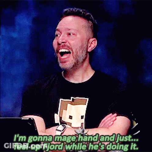 Man In Black Shirt With Minecraft Logo Laughing GIF