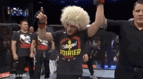 Man In Black Shirt With Pourier In Ring GIF