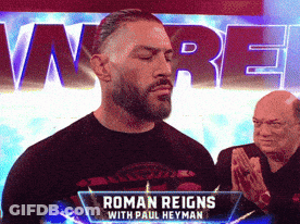 Man In Black Shirt With Roman Reigns GIF