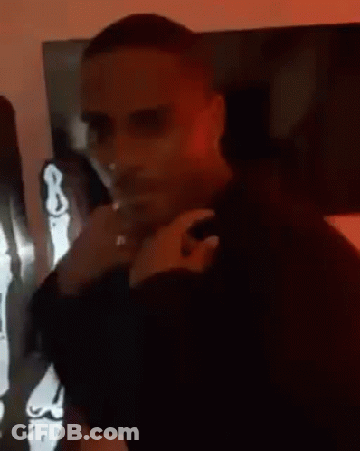 Man In Black Shirt With Skeleton Statue GIF