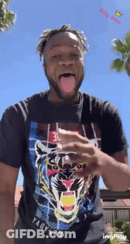 Man In Black Shirt With Tiger Sticking Out Tongue GIF