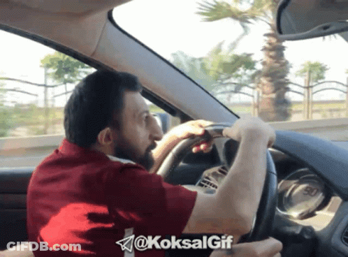 Man In Black Shirt With Triangle Next To Man In Black Jacket GIF