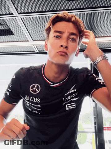 Man In Black Shirt With UBS And INEOS GIF