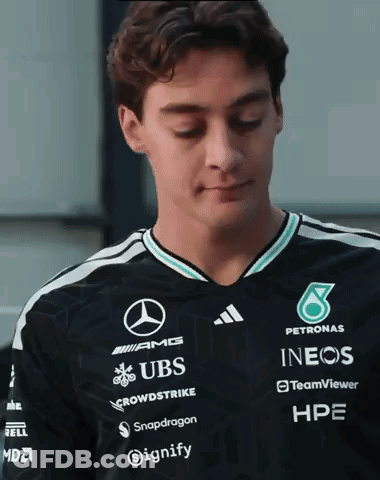 Man In Black Shirt With UBS Snapdragon INEOS GIF