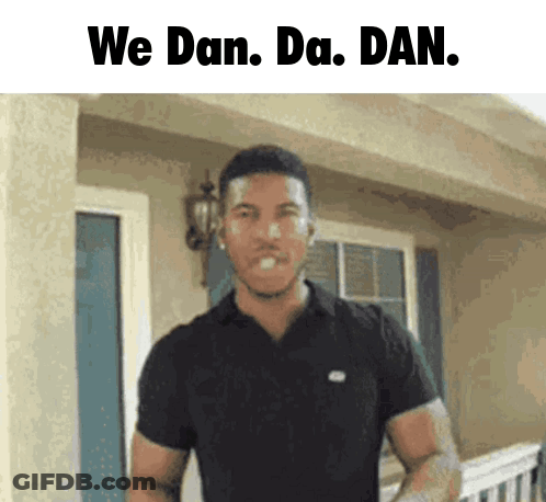 Man In Black Shirt With We Dan Da Dan Above Him GIF