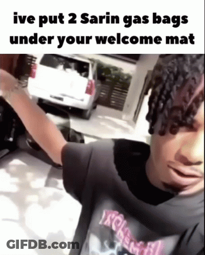 Man In Black Shirt With Welcome Mat Joke GIF