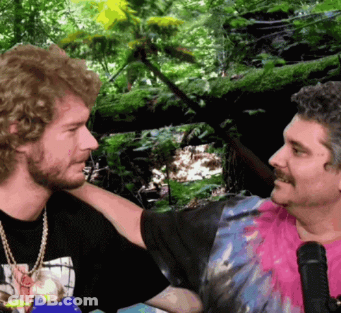Man In Black Shirt With Woman Picture Talking To Another Man GIF