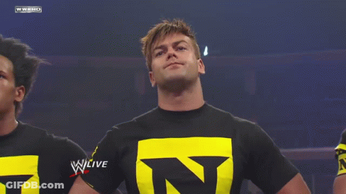 Man In Black Shirt With Yellow Letter N GIF