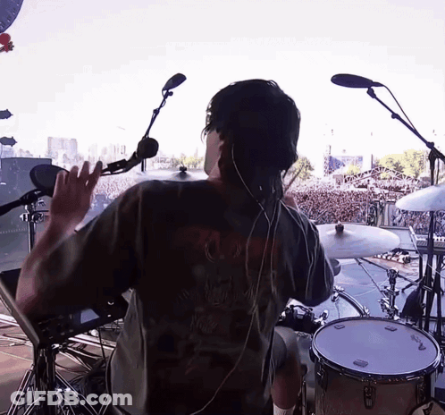 Man In Black Skull Shirt Playing Drums GIF