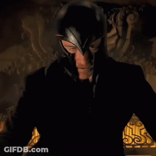 Man In Black Suit And Helmet Standing At Statue GIF