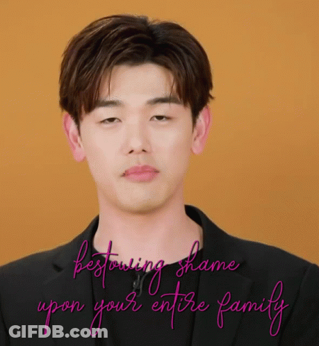 Man In Black Suit Bestowing Shame Upon Your Entire Family GIF