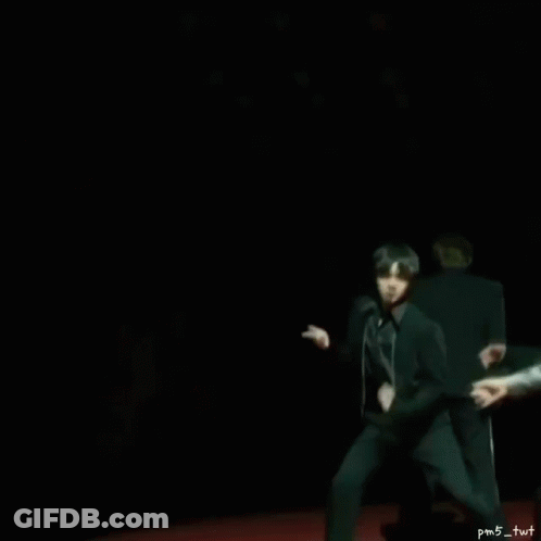 Man In Black Suit Dancing As Another Watches GIF