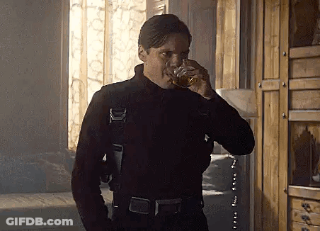 Man In Black Suit Drinking Whiskey GIF